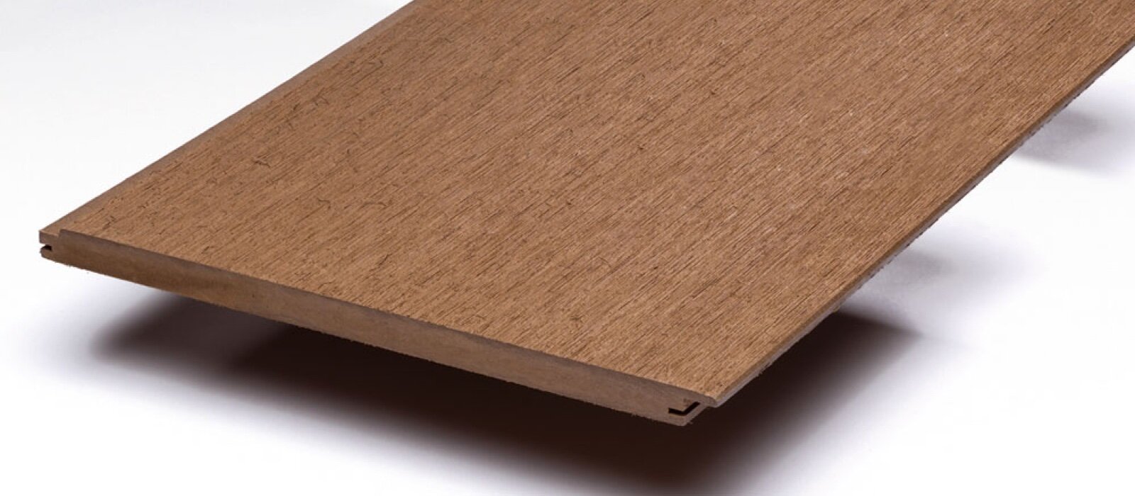 A brown wood-plastic composite tongue and groove cladding board with a wood-grain face
